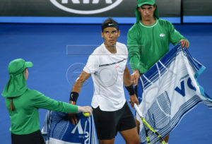 Rafael Nadal of Spain receives a towel form a ballgirl during his Men's Singles semi-final match against Grigor Dimitrov of Bulgaria at the Australian Open Grand Slam tennis tournament in Melbourne, Victoria, Australia, 27 January 2017.  EPA/LYNN BO BO