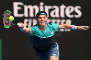 Milos Raonic of Canada in action against Stan Wawrinka of Switzerland during their second round match on day four of the Australian Open tennis tournament in Melbourne, Australia, 17 January 2019.  EPA-EFE/JULIAN SMITH  AUSTRALIA AND NEW ZEALAND OUT