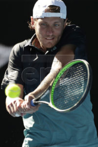 Lucas Pouille of France in action against Milos Raonic of Canada during their men's singles quarterfinals match at the Australian Open Grand Slam tennis tournament in Melbourne, Australia, 23 January 2019.  EPA-EFE/LYNN BO BO