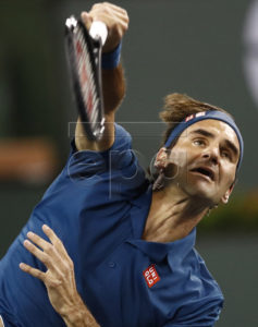 Roger Federer of Switzerland in action against Stan Wawrinka of Switzerland during the BNP Paribas Open tennis tournament at the Indian Wells Tennis Garden in Indian Wells, California, USA, 12 March 2019. The men's and women's final will be played, 17 March 2019.  EPA-EFE/LARRY W. SMITH