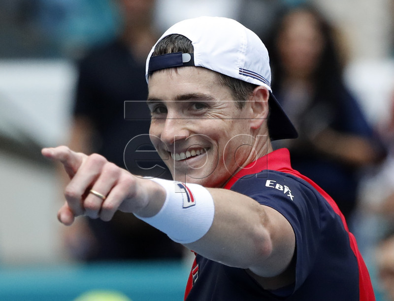 John Isner of the US reacts after defeating Felix Auger Aliassime of Canada during their men's semifinals match at the Miami Open tennis tournament in Miami, Florida, USA, 29 March 2019.  EPA-EFE/JASON SZENES