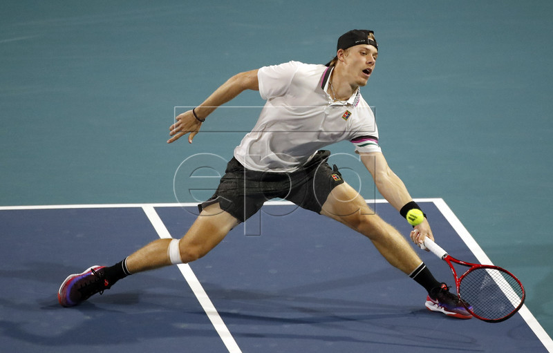 Denis Shapovalov of Canada in action against Roger Federer of Switzerland during their men's semifinals match at the Miami Open tennis tournament in Miami, Florida, USA, 29 March 2019.  EPA-EFE/JASON SZENES
