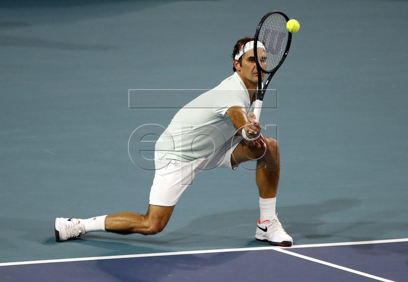 Roger Federer of Switzerland in action against Denis Shapovalov of Canada during their men's semifinals match at the Miami Open tennis tournament in Miami, Florida, USA, 29 March 2019.  EPA-EFE/JASON SZENES