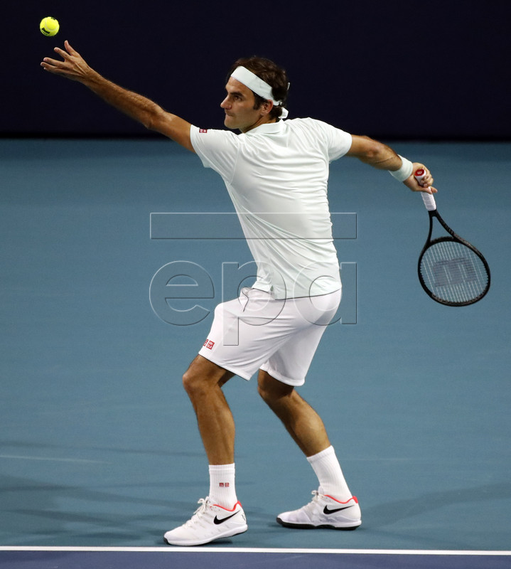Roger Federer of Switzerland in action against Denis Shapovalov of Canada during their men's semifinals match at the Miami Open tennis tournament in Miami, Florida, USA, 29 March 2019.  EPA-EFE/JASON SZENES