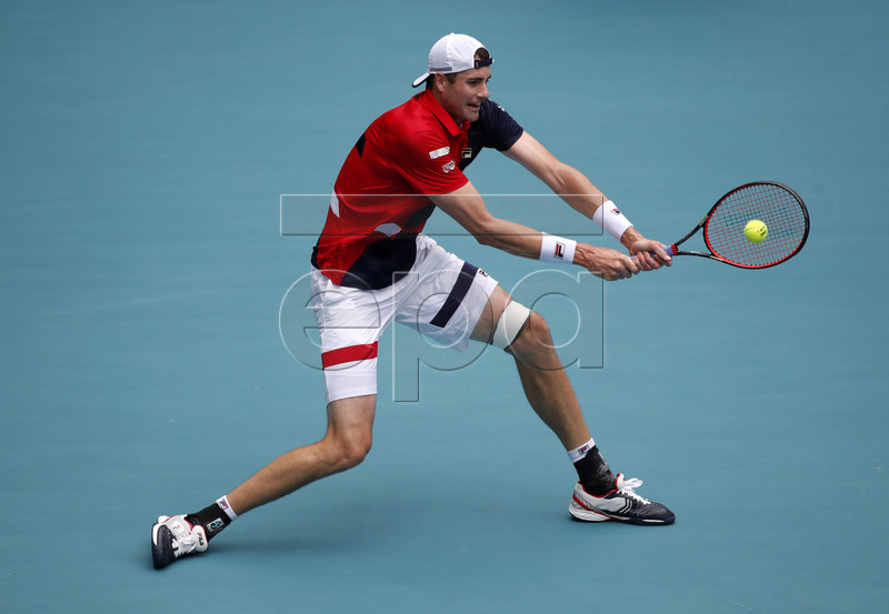 John Isner of the US in action against  Roger Federer of Switzerland during their Men's finals match at the Miami Open tennis tournament in Miami, Florida, USA, 31 March 2019.  EPA-EFE/JASON SZENES