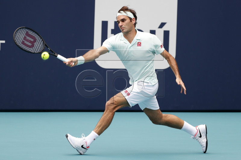Roger Federer of Switzerland in action against John Isner of the US during their Men's finals match at the Miami Open tennis tournament in Miami, Florida, USA, 31 March 2019.  EPA-EFE/RHONA WISE