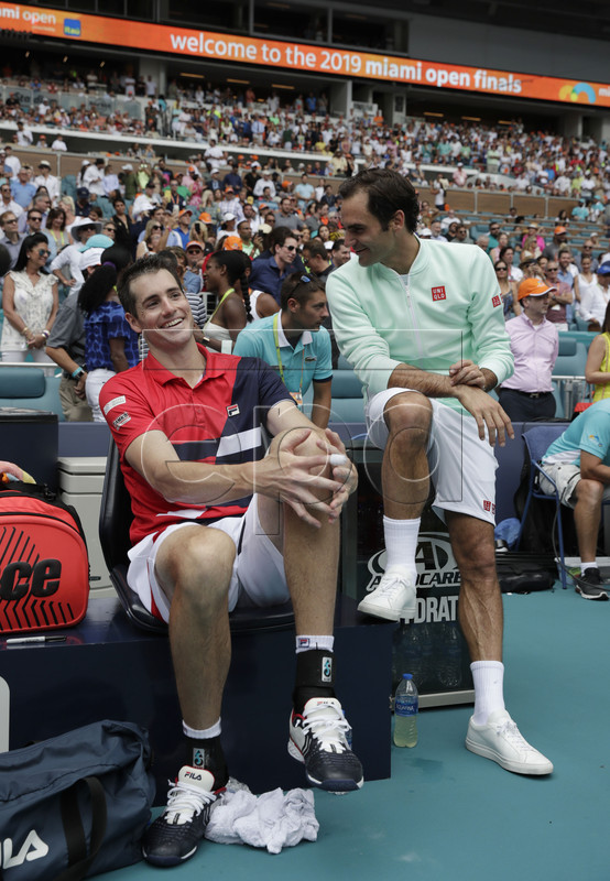  Roger Federer of Switzerland (R) and John Isner of the US (L) talk on the bench following their Men's finals match at the Miami Open tennis tournament in Miami, Florida, USA, 31 March 2019.  EPA-EFE/JASON SZENES
