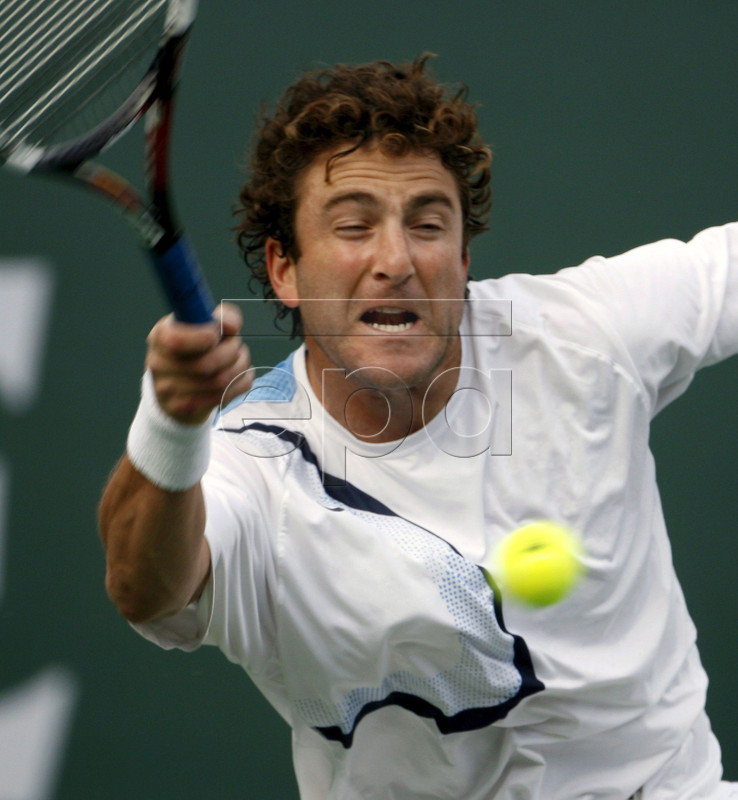 American Justin Gimelstob returns a shot against Lucasz Kubot during men's qualifying at the Pacific Life Open tennis tournament in Indian Wells, California, Thursday, 09 March 2006. EPA/PAUL BUCK