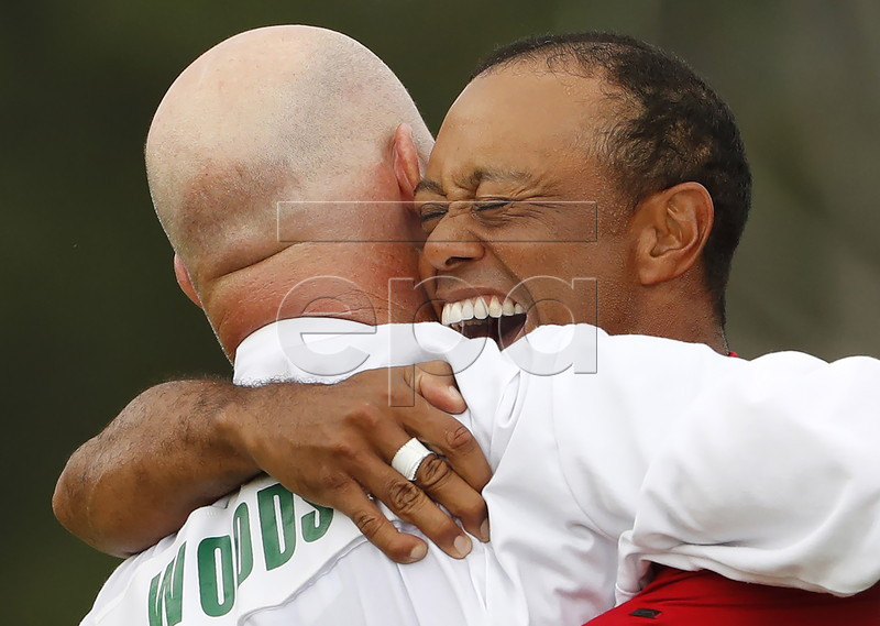 Tiger Woods of the US celebrates with caddie Joe LaCava (L) after winning the 2019 Masters Tournament at the Augusta National Golf Club in Augusta, Georgia, USA, 14 April 2019. The 2019 Masters Tournament is held 11 April through 14 April 2019. EPA-EFE/ERIK S. LESSER