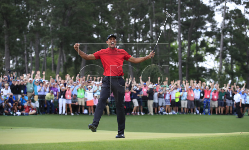 Tiger Woods of the US celebrates after winning the 2019 Masters Tournament at the Augusta National Golf Club in Augusta, Georgia, USA, 14 April 2019. The 2019 Masters Tournament is held 11 April through 14 April 2019. EPA-EFE/TANNEN MAURY