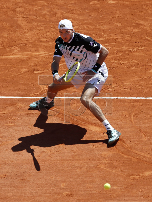 Jan-Lennard Struff of Germany returns the ball to Denis Shapovalov of Canada during their first round match at the Monte-Carlo Rolex Masters tennis tournament in Roquebrune Cap Martin, France, 15 April 2019.  EPA-EFE/SEBASTIEN NOGIER