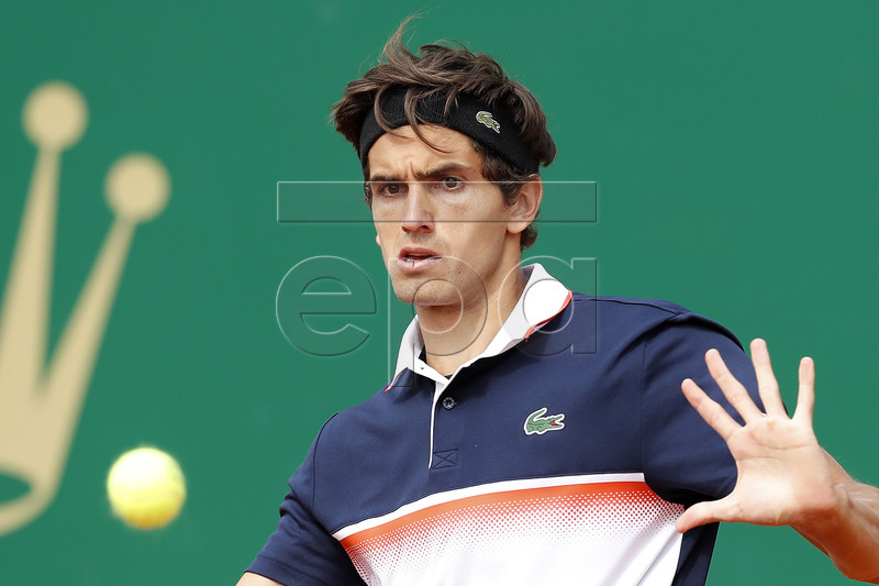 Pierre-Hugues Herbert of France returns the ball to Fernando Verdasco of Spain during their first round match at the Monte-Carlo Rolex Masters tennis tournament in Roquebrune Cap Martin, France, 16 April 2019.  EPA-EFE/SEBASTIEN NOGIER