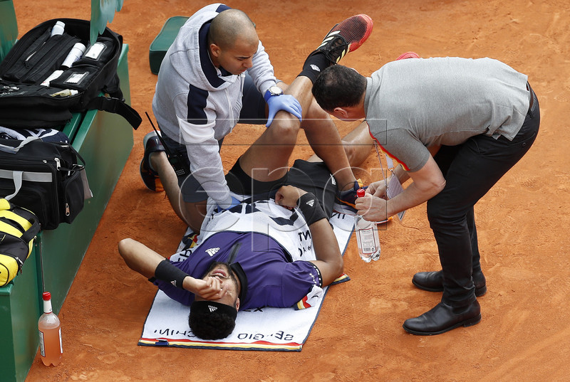 Jo-Wilfried Tsonga of France is treated during his first round match against Taylor Fritz of US at the Monte-Carlo Rolex Masters tournament in Roquebrune Cap Martin, France, 16 April 2019. Jo-Wilfried Tsonga retired for injury.  EPA-EFE/SEBASTIEN NOGIER