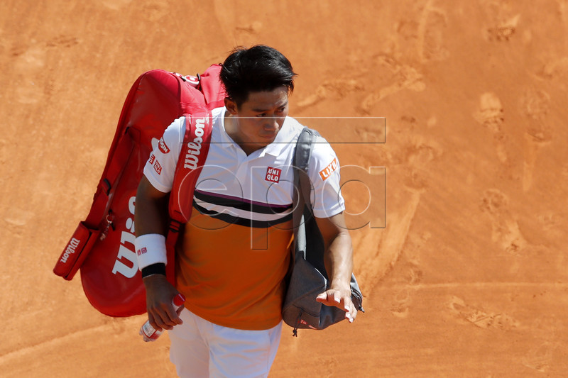 Kei Nishikori of Japan leaves the court after losing to Pierre-Hugues Herbert of France in their second round match at the Monte-Carlo Rolex Masters tournament in Roquebrune Cap Martin, France, 17 April 2019. EPA-EFE/SEBASTIEN NOGIER