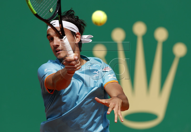 Lorenzo Sonego of Italy in action during his quarterfinal match against Dusan Lajovic of Serbia at the Monte-Carlo Rolex Masters tournament in Roquebrune Cap Martin, France, 19 April 2018.  EPA-EFE/SEBASTIEN NOGIER