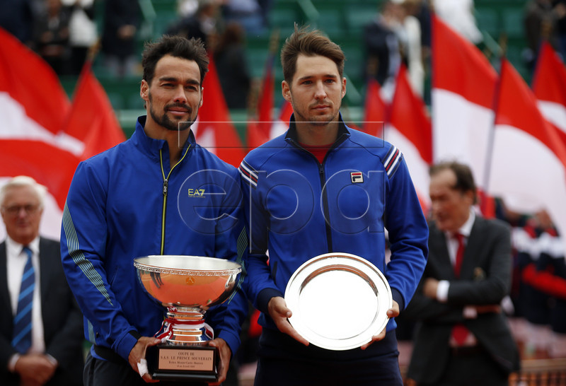Winner Fabio Fognini of Italy (L) poses with his trophy next to runner up Dusan Lajovic of Serbia (R) after the final match of the Monte-Carlo Rolex Masters tournament in Roquebrune Cap Martin, France, 21 April 2019.  EPA-EFE/SEBASTIEN NOGIER