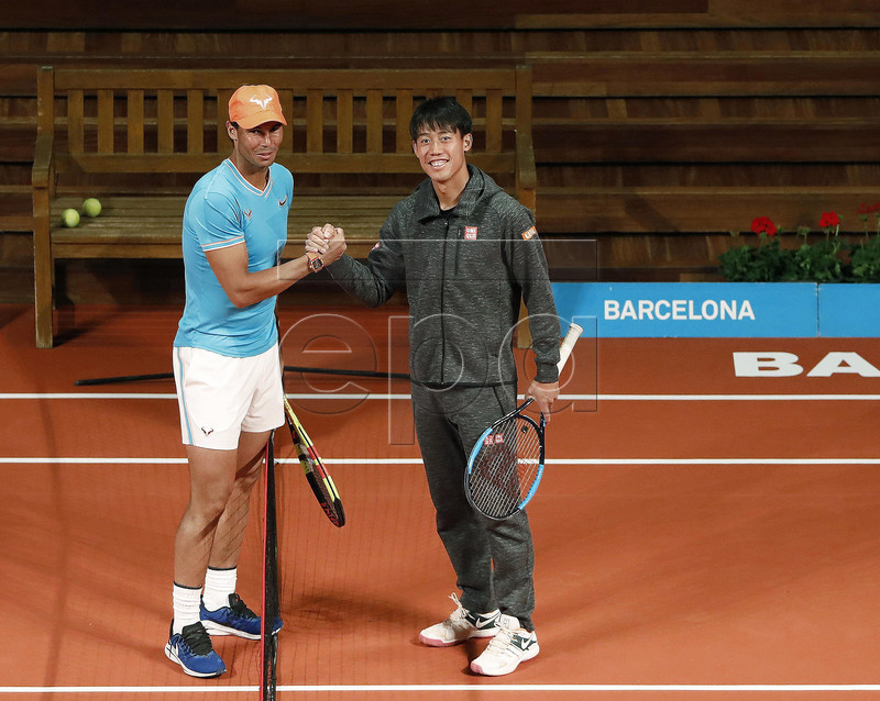 Spanish tennis player Rafael Nadal (L) and Kei Nishikori (R) of Japan pose during a press preview on occasion of the presentation of the 67th Barcelona Open Trofeo Conde de Godo tennis tournament at the Catalan Music Palace in Barcelona, Spain, 22 April 2019. The arcelona Open Trofeo Conde de Godo tennis tournament 2019 will be played in Barcelona from 20 until 28 April 2019.  EPA-EFE/Andreu Dalmau