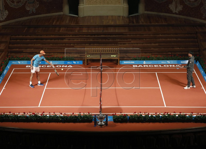 Spanish tennis player Rafael Nadal (L) and Kei Nishikori (R) of Japan warm up during a press preview on occasion of the presentation of the 67th Barcelona Open Trofeo Conde de Godo tennis tournament at the Catalan Music Palace in Barcelona, Spain, 22 April 2019. The arcelona Open Trofeo Conde de Godo tennis tournament 2019 will be played in Barcelona from 20 until 28 April 2019.  EPA-EFE/Andreu Dalmau