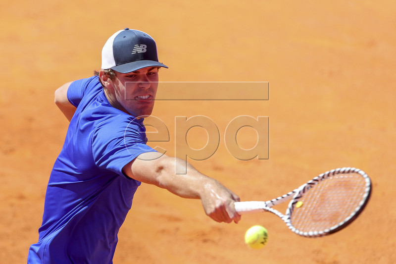 Reilly Opelka of the USA in action against Gael Monfils of France during their second round match at the Estoril Open tennis tournament in Cascais, near Lisbon, Portugal, 01 May 2019.  EPA-EFE/JOSE SENA GOULAO