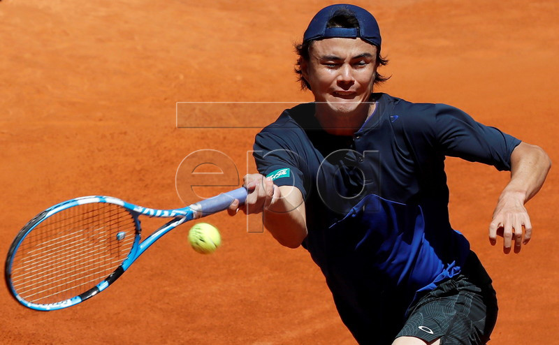 Japan's Taro Daniel in action during his qualifying match against Spanish player Albert Ramos at the Mutua Madrid Open tennis tournament in Madrid, Spain, 04 May 2019. EPA-EFE/CHEMA MOYA
