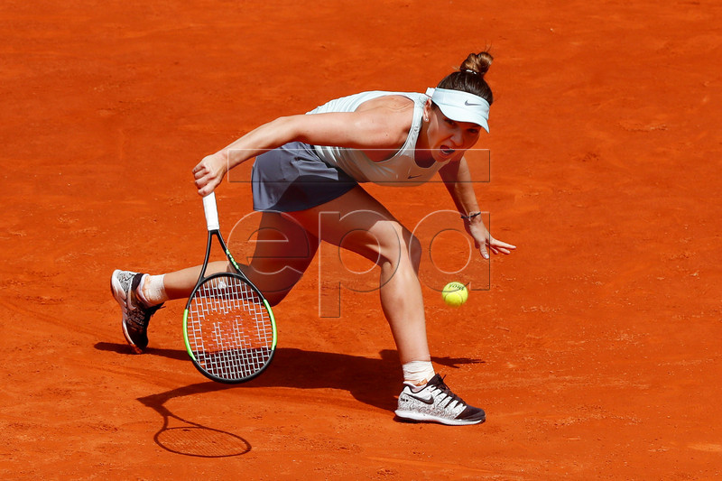 Simona Halep of Romania in action against Johanna Konta of Britain during their second round match of the Mutua Madrid Open tennis tournament at the Caja Magica complex in Madrid, Spain, 07 May 2019.  EPA-EFE/CHEMA MOYA