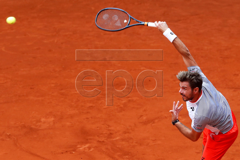 Stan Wawrinka of Switzerland in action against Pierre-Hugues Herbert of France during their first round match of the Mutua Madrid Open tennis tournament at the Caja Magica complex in Madrid, Spain, 07 May 2019.  EPA-EFE/CHEMA MOYA