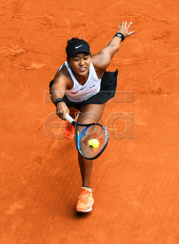 Naomi Osaka of Japan in action against Aliaksandra Sasnovich of Belarus during their third round match of the Mutua Madrid Open tennis tournament at the Caja Magica complex in Madrid, Spain, 08 May 2019. EPA-EFE/FERNANDO VILLAR