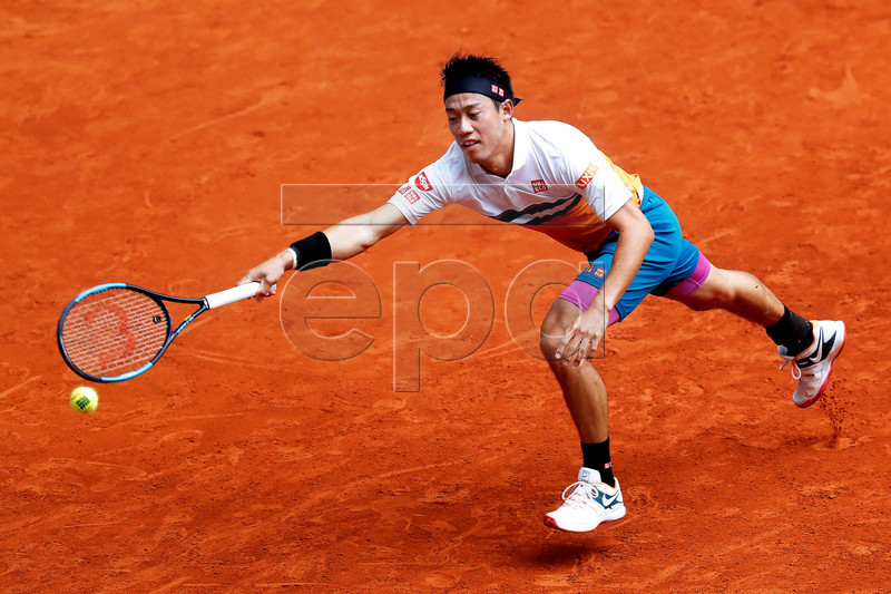 Kei Nishikori of Japan in action against Hugo Dellien of Bolivia during their second round match of the Mutua Madrid Open tennis tournament at the Caja Magica complex in Madrid, Spain, 08 May 2019.  EPA-EFE/CHEMA MOYA
