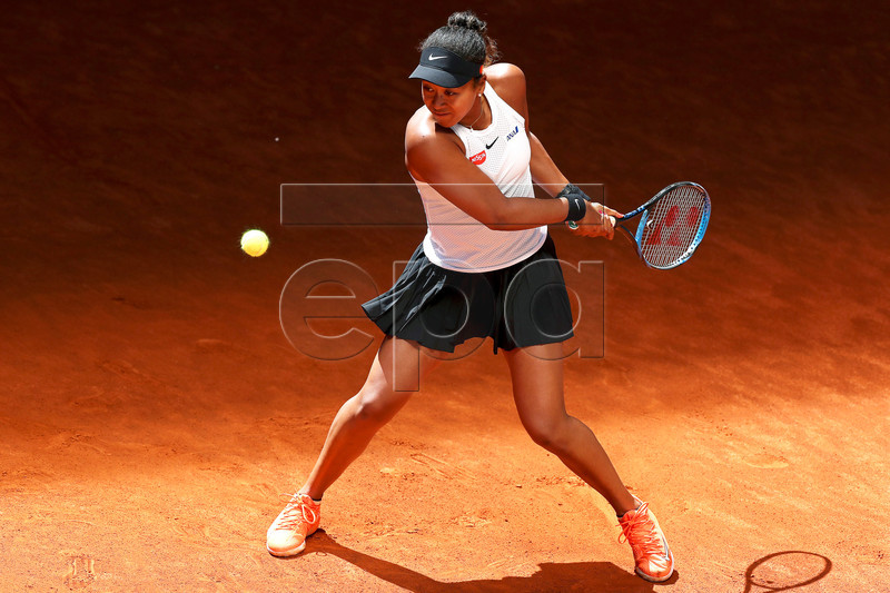 Naomi Osaka of Japan in action against Belinda Bencic of Switzerland during their quarter final match of the Mutua Madrid Open tennis tournament at the Caja Magica complex in Madrid, Spain, 09 May 2019.  EPA-EFE/KIKO HUESCA