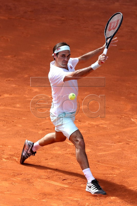 Roger Federer of Switzerland in action against Gael Monfils of France during their third round match of the Mutua Madrid Open tennis tournament at the Caja Magica complex in Madrid, Spain, 09 May 2019.  EPA-EFE/Kiko Huesca