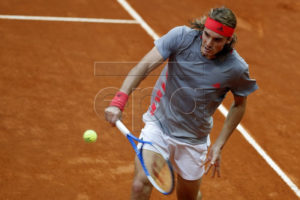 Stefanos Tsitsipas of Greece in action against Alexander Zverev of Germany during their quarter final match at the Mutua Madrid Open tennis tournament in Madrid, Spain, 10 May 2019. EPA-EFE/JAVIER LIZON