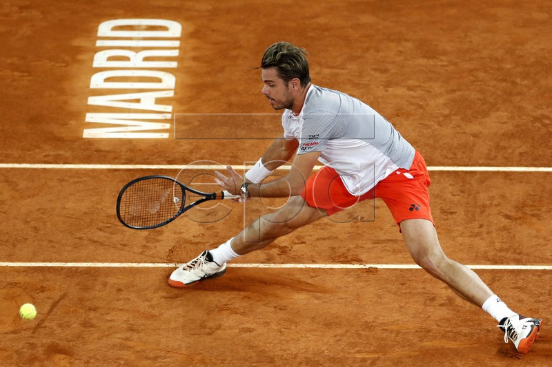 Swiss tennis player Stan Wawrinka in action against Rafal Nadal of Spain during their quarterfinal match played at the Mutua Madrid Open tennis tournament in Madrid, Spain, 10 May 2019.  EPA-EFE/JAVIER LIZON