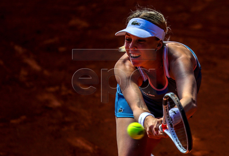 Anett Kontaveit from Estonia in action against Aliaksandra Sasnovich of Belarus during their first round match of the Mutua Madrid Open 2019 tennis tournament at Caja Magica in Madrid, Spain, 04 April 2019.  EPA-EFE/JUANJO MARTIN