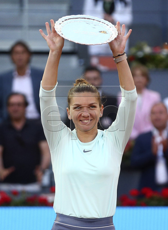 Simona Halep of Romania shows her runner-up throphy after losing against Kiki Bertens of Netherlands during their Mutua Madrid Open tennis final game at Caja Magica, in Madrid, Spain, 11 May 2019.  EPA-EFE/Rodrigo Jimenez