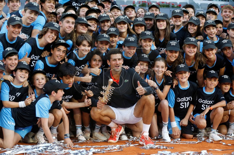 Novak Djokovic of Serbia poses for the photographers after his victory against Stefanos Tsitsipas of Greece (unseen) during their Mutua Madrid Open tennis final game at Caja Magica, in Madrid, Spain, 12 May 2019.  EPA-EFE/KIKO HUESCA