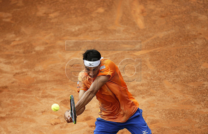 Lorenzo Sonego of Italy in action against Karen Khachanov of Russia during their men's singles first round match at the Italian Open tennis tournament in Rome, Italy, 13 May 2019.  EPA-EFE/RICCARDO ANTIMIANI