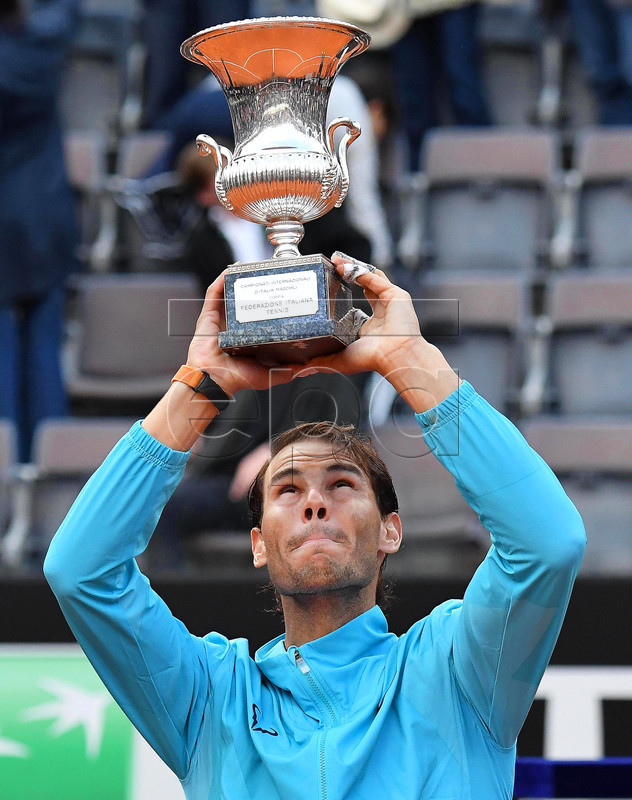 Rafael Nadal of Spain lifts his trophy after defeating Novak Djokovic of Serbia in their men's singles final match at the Italian Open tennis tournament in Rome, Italy, 19 May 2019.  EPA-EFE/ETTORE FERRARI
