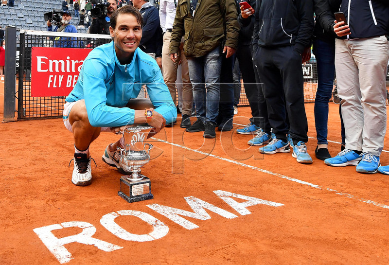 Rafael Nadal of Spain poses with his trophy after defeating Novak Djokovic of Serbia in their men's singles final match at the Italian Open tennis tournament in Rome, Italy, 19 May 2019.  EPA-EFE/ETTORE FERRARI