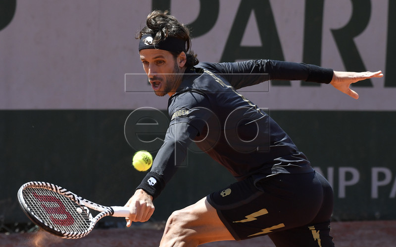 Feliciano Lopez of Spain plays Ivo Karlovic of Croatia during their men?s first round match during the French Open tennis tournament at Roland Garros in Paris, France, 28 May 2019. EPA-EFE/JULIEN DE ROSA