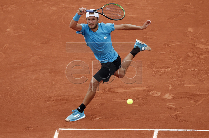 Lucas Pouille of France plays Simone Bolelli of Italy during their men?s first round match during the French Open tennis tournament at Roland Garros in Paris, France, 28 May 2019. EPA-EFE/YOAN VALAT
