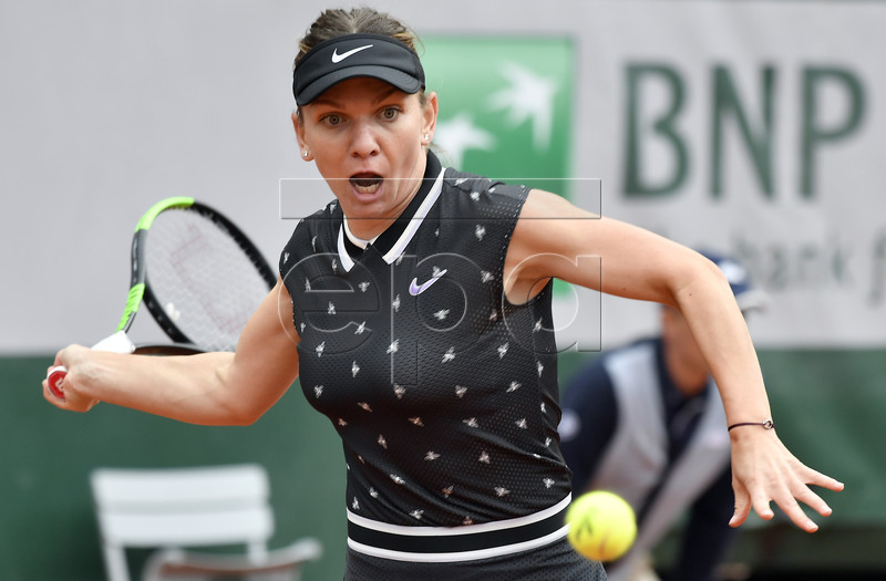 Simona Halep of Romania plays Ajla Tomljanovic of Australia during their women?s first round match during the French Open tennis tournament at Roland Garros in Paris, France, 28 May 2019. EPA-EFE/JULIEN DE ROSA