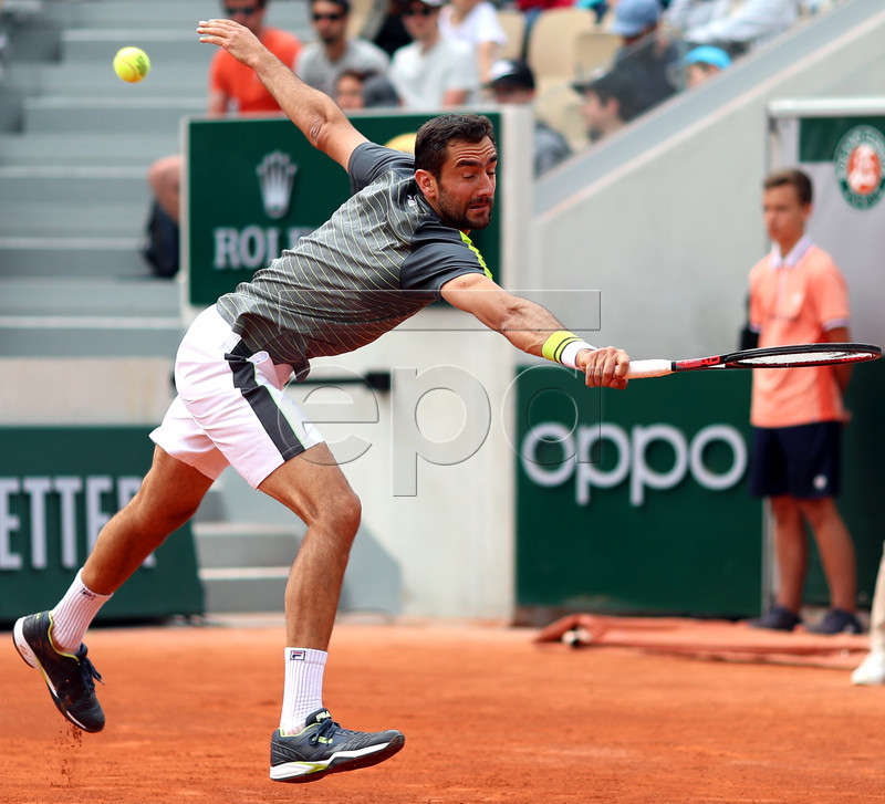 Marin Cilic of Croatia plays Grigor Dimitrov of Bulgaria during their men?s second round match during the French Open tennis tournament at Roland Garros in Paris, France, 29 May 2019.  EPA-EFE/SRDJAN SUKI