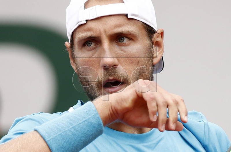 Lucas Pouille of France plays Martin Klizan of Slovakia during their men?s second round match during the French Open tennis tournament at Roland Garros in Paris, France, 31 May 2019. EPA-EFE/YOAN VALAT