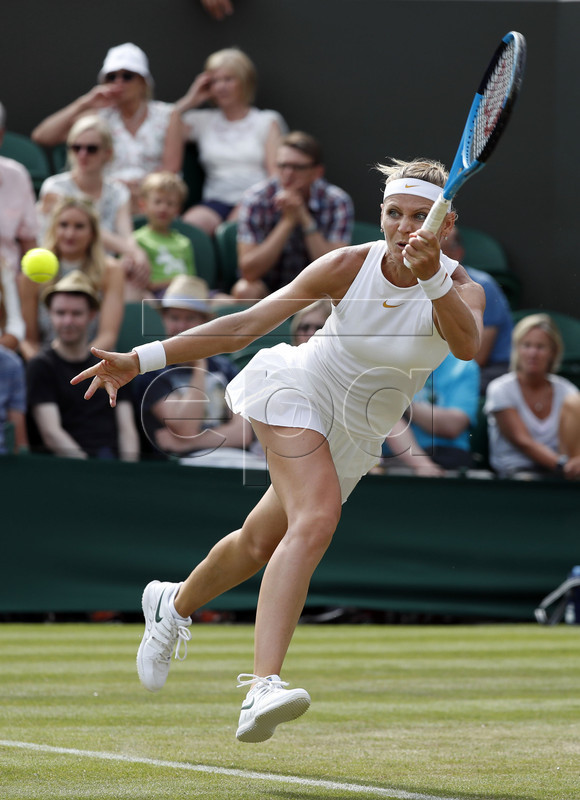 Lucie Safarova of the Czech Republic returns to Agnieszka Radwanska of Poland in their second round match during the Wimbledon Championships at the All England Lawn Tennis Club, in London, Britain, 04 July 2018. EPA-EFE/NIC BOTHMA EDITORIAL USE ONLY/NO COMMERCIAL SALES