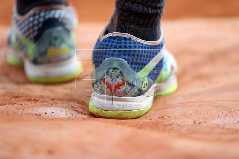 The shoes of Rafael Nadal of Spain as he plays Kei Nishikori of Japan during their men?s quarter final match during the French Open tennis tournament at Roland Garros in Paris, France, 04 June 2019. EPA-EFE/SRDJAN SUKI