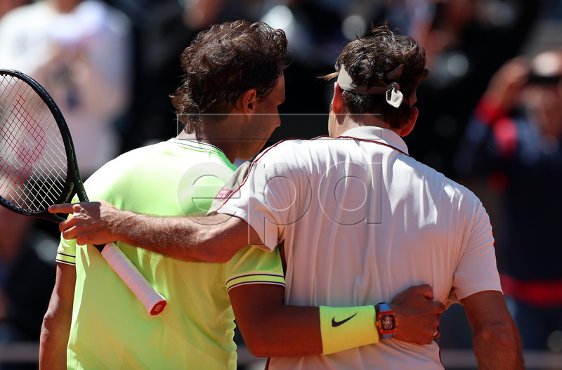 Rafael Nadal of Spain (L) reacts with Roger Federer of Switzerland after winning their men?s semi final match during the French Open tennis tournament at Roland Garros in Paris, France, 07 June 2019. EPA-EFE/SRDJAN SUKI