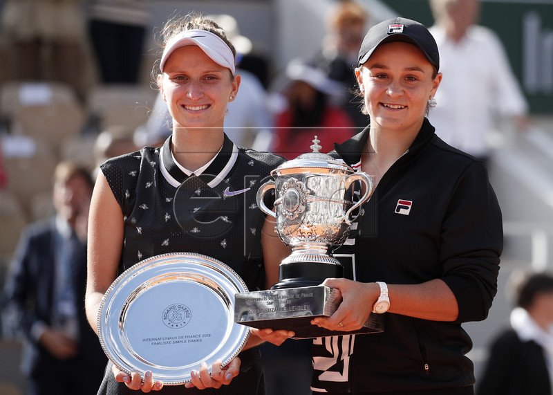 Winner Ashleigh Barty of Australia (R) and runner-up Marketa Vondrousova of the Czech Republic poses with their trophies after the women?s final match during the French Open tennis tournament at Roland Garros in Paris, France, 08 June 2019. EPA-EFE/YOAN VALAT