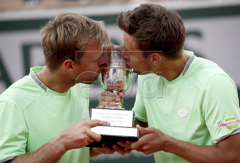 Kevin Krawietz (L) and Andreas Mies of Germany pose with the trophy after winning the men?s doubles final match during the French Open tennis tournament at Roland Garros in Paris, France, 08 June 2019. EPA-EFE/YOAN VALAT