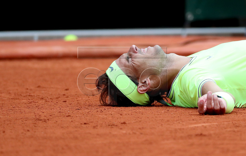 Rafael Nadal of Spain reacts after winning the men?s final match against Dominic Thiem of Austria during the French Open tennis tournament at Roland Garros in Paris, France, 09 June 2019. Nadal won the French Open title 12th times. EPA-EFE/SRDJAN SUKI