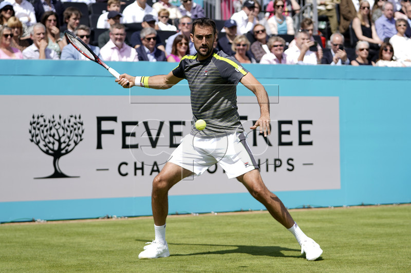 Croatia's Marin Cilic returns to Chile's Cristian Garin during their round 32 match at the Fever Tree Championship at Queen's Club in London, Britain, 17 June 2019. The tournament runs from 17th June till 23 June 2019. EPA-EFE/WILL OLIVER